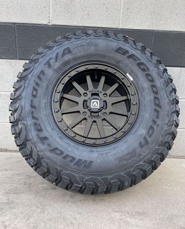 valor beadlock 15X7 4x137 4+3 Black Wheels & 30x10-15 BF Goodrich KM3 Tires  (FREE Mounted)