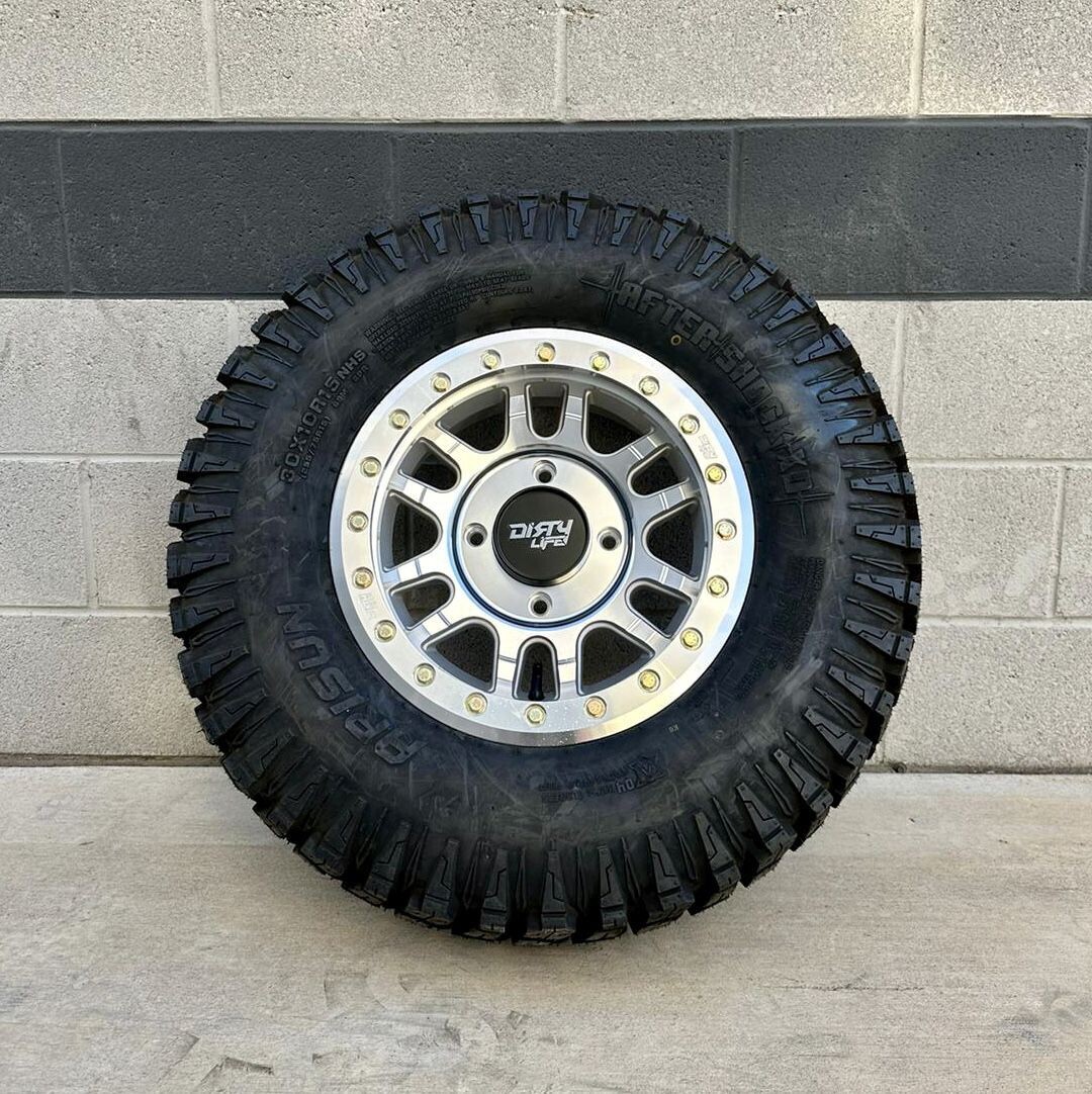 Dirty life beadlock 15X7 4x137 4+3 Machined Silver With Gold Bolts Wheels & 30x10-15 Arisun After Shock XD Tires  (FREE Mounted
