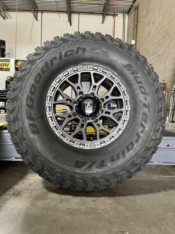 AXE 15X7 4x137 4x156 4+3  Wheels & 30x10-15 BF Goodrich KM3 Tires  (FREE Mounted)