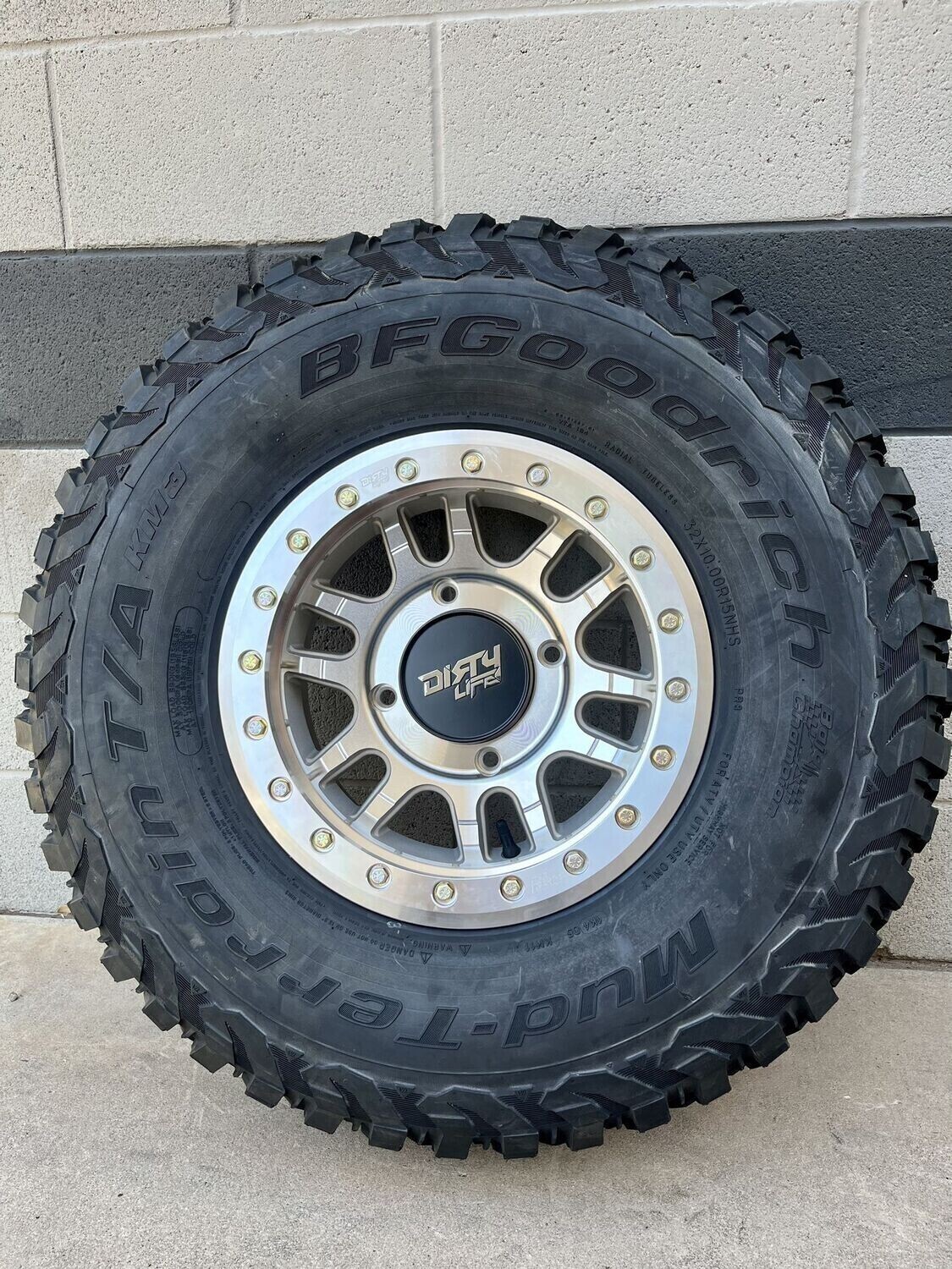 dirty life 15X7 4x156 Beadlock  Wheels & 30x10-15 BF Goodrich KM3 Tires (FREE Mounted