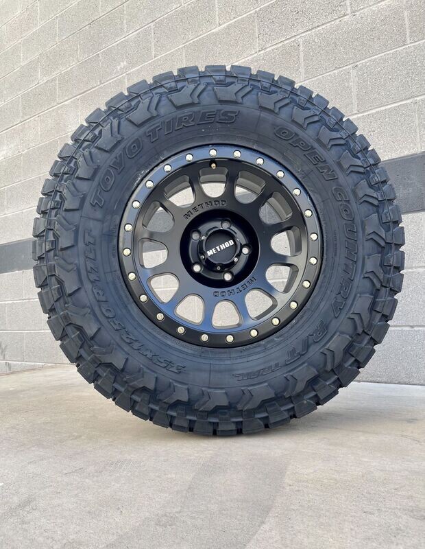 Wheel & Tire Package Method MR305 17X8.5 6x139.7 Black  Wheels &  285-70-17  Toyo R/T Trail Tires