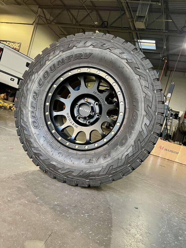 Wheel & Tire Method Race 17x8.5 6x135 Matte Black Wheels &  285-70-17 Toyo Open Country R/T Tires