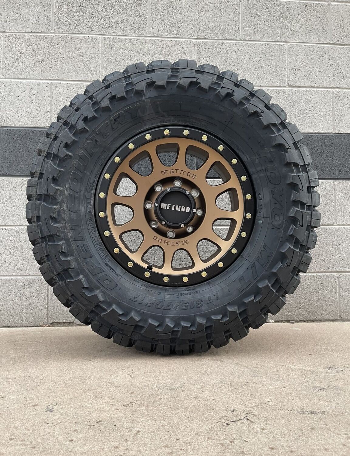 Wheel & Tire Method Race 17x8.5 8x165.1 Bronze Black Ring Wheels &  33X12.50R17 Toyo Open Country M/T Tires