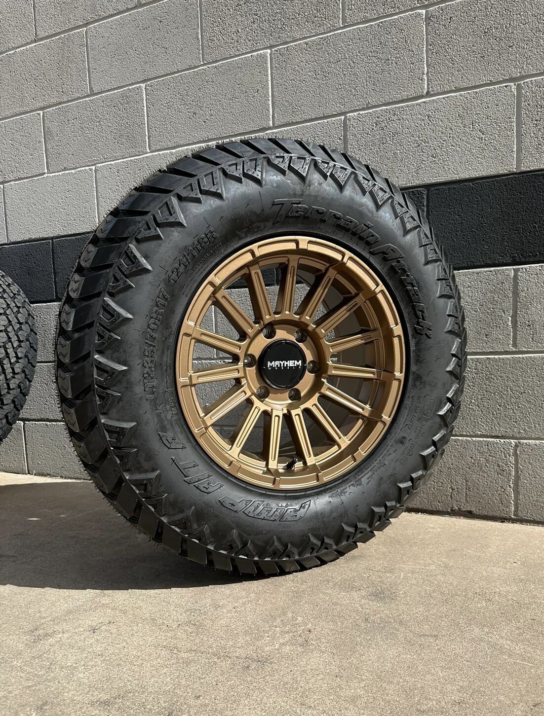Wheel & Tire Mayhem 17x9 6x135 Matte Bronze Wheels & 285-70-17 Amp Terrain Attack A/T Tires