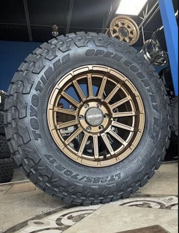 Wheel & Tire Mayhem 17x9 6x135 Bronze Wheels & 285-70-17 Toyo R/T Trail Tires