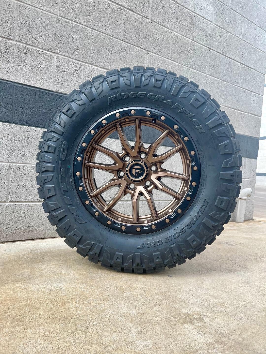 Wheel & Tire Fuel Rebel 20x10 6x139.7 Bronze Wheels & 33X12.50R20 Nitto Ridge Grappler Hybrid Tires