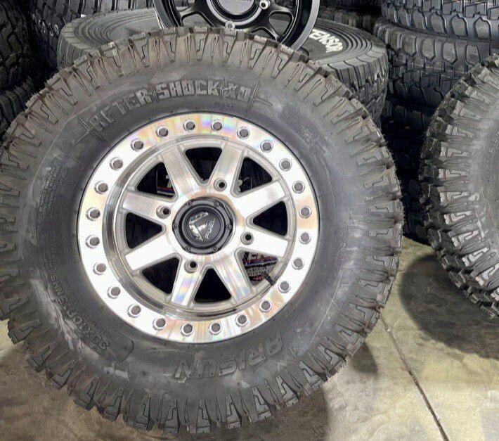 wheel & tire package Fuel Maverick 15x7 4x137Beadlock  Silver Machine Wheels & Arisun Aftershock XD 30x10-15 Tires (FREE Mounted)