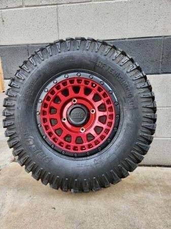 Black Rhino Parker 15X7 4x137 Red With Black Ring  Wheels & 33x9.5R15 Arisun Aftershock XD Tires (mounted )