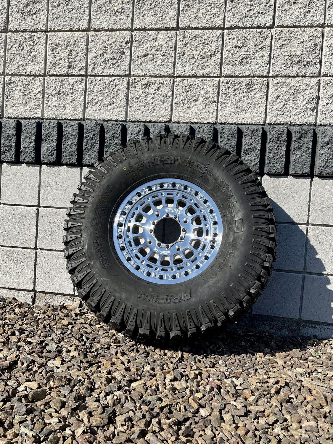 Metal FX 15X6 4X156 Machine Silver Beadlock Wheels & 33X9.5R15 Arisun Aftershock XD Tires