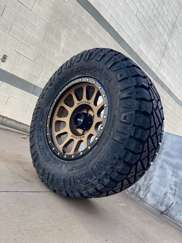 Wheel & Tire Method MR305 18x9 8x165.1 Bronze Wheels & 35x12.50-18 Nitto Ridge Grappler Tires