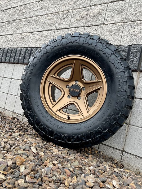 4 Wheel & Tire Method Race MR319 17x8.5  6x135 Bronze Wheels & 33x12.50-R17 Forceland Rebel Hawk Tires