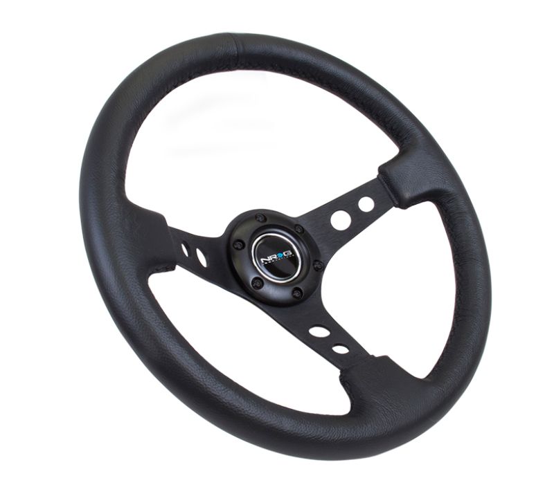 NRG Reinforced Steering Wheel (350mm / 3in. Deep) Blk Leather w/Blk Spoke & Circle Cutouts NRG Reinforced Steering Wheel (350mm / 3in. Deep) Blk Leather w/Blk Spoke & Circle Cutouts