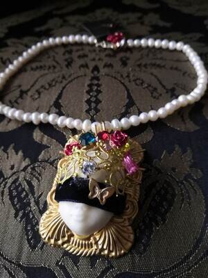 Blinder doll necklace