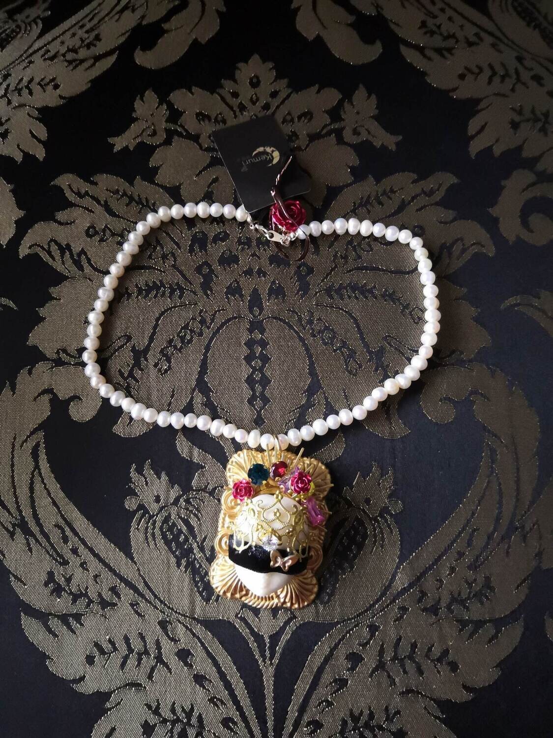 Blinder doll necklace