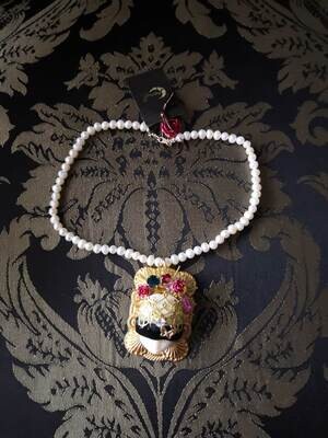 Blinder doll necklace