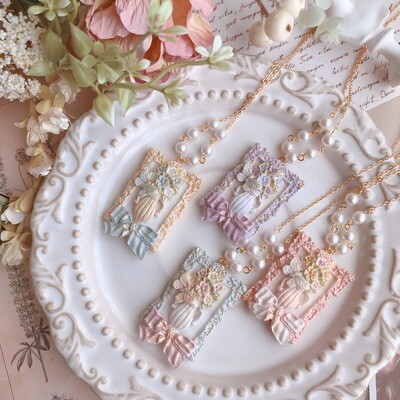 Painting of flower and butterfly necklace