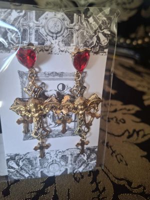 Shaking Cross piercing