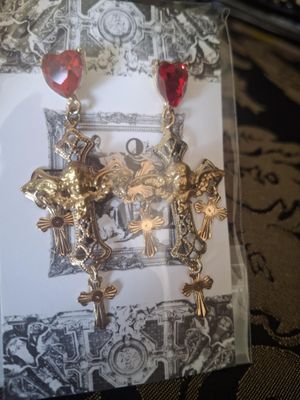 Shaking Cross piercing