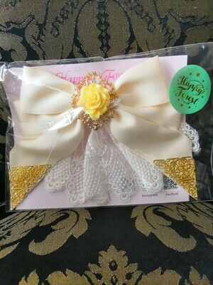 Ribbon hair accessory with rose