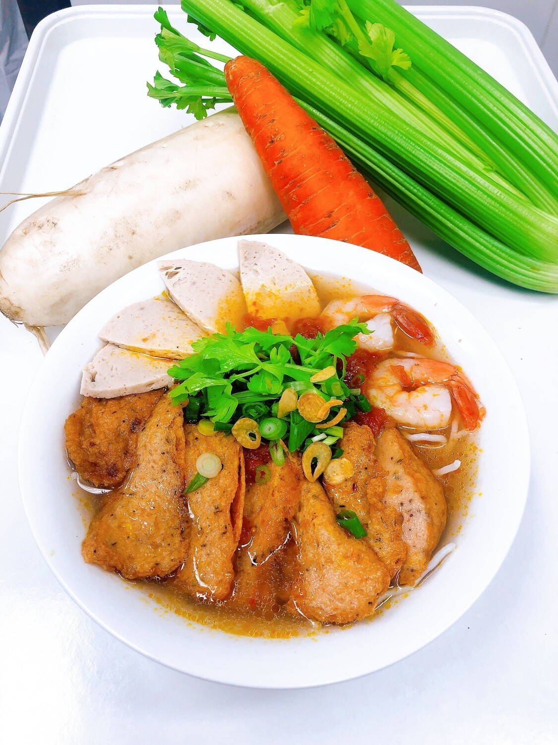 211- Vietnamese Fish Cake, Shrimp, and Sausage with Vermicelli tomato soup