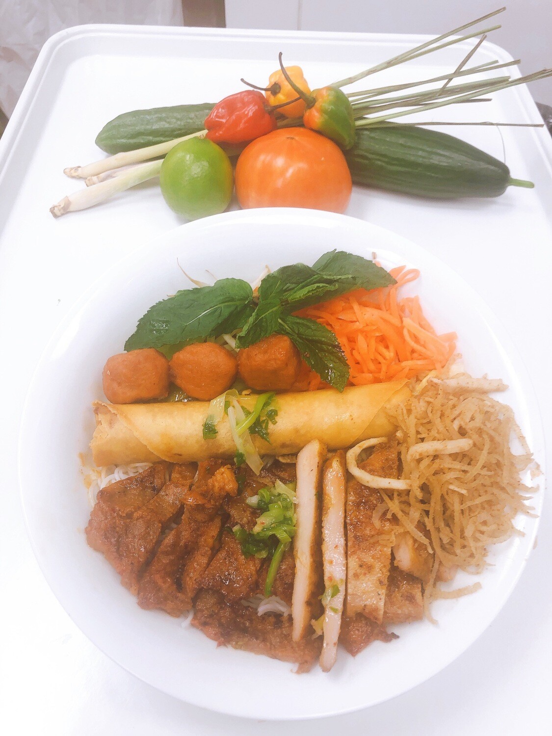 412- Vermicelli with Grilled Pork, Meatballs, Chicken, Spring Roll, and Shredded Pork Skin
