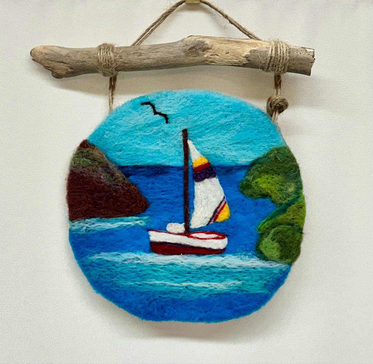 Small Felted Boat in a Cove with Driftwood