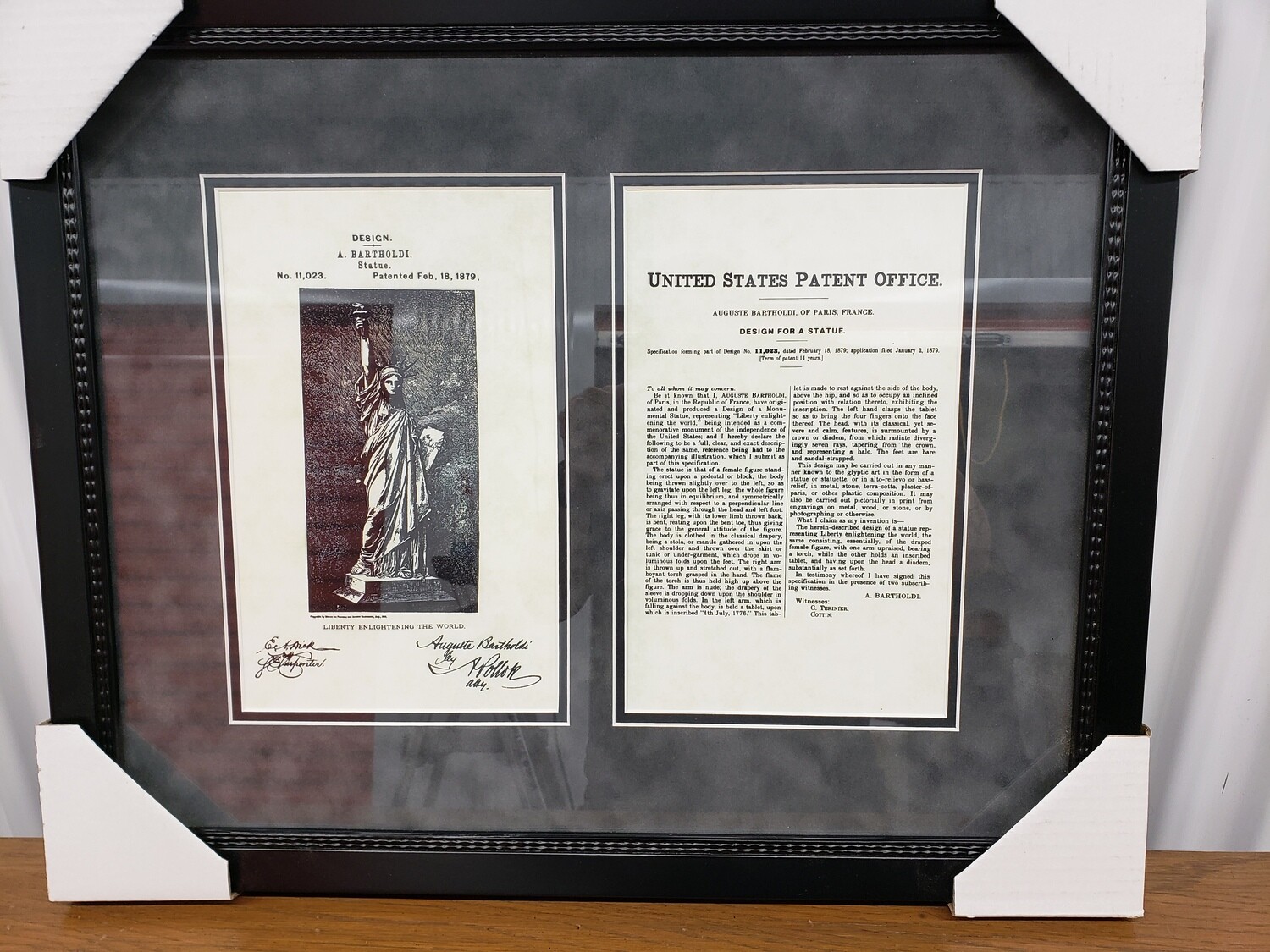 Framed replica of Statue of Liberty U.S. Patent #2118