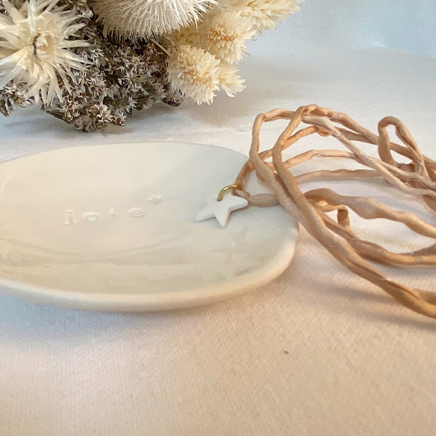 Bracelet soie rose clair étoile