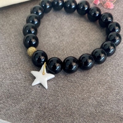 Bracelet grosses perles noires étoile