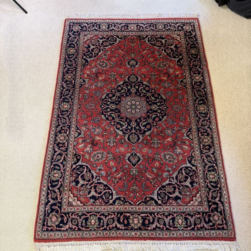 Red fringed Kashan rug with green, blue, tan, minor wear, a few areas of small thread loss, thick 1/2 inch pile 60" x 38"