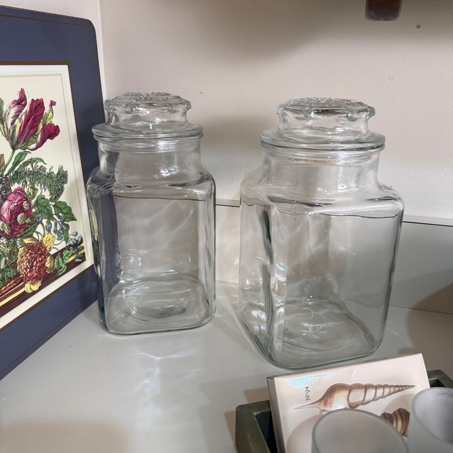 Pair of clear glass canisters 9"H