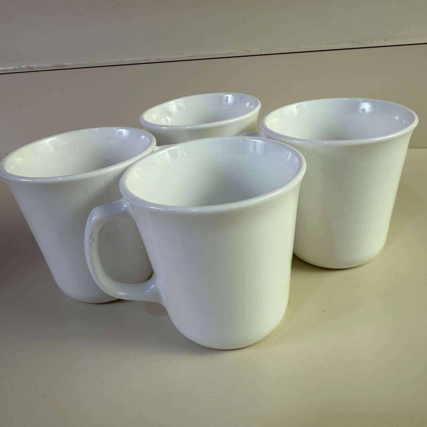 Group of white corning coffee cups