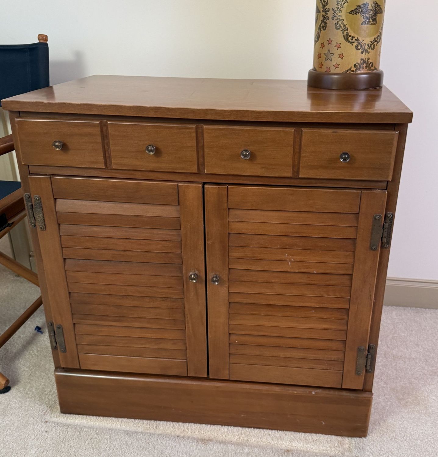 Two-door cabinet with louvered doors and single drawer, has a hole in back to accommodate electric cord, lightweight (This item is upstairs) 29"H x 29"W x 19"D