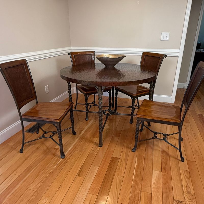 REDUCED - Riverside Furniture Medley table 30 REDUCED - Riverside Furniture Medley table 30"H with enameled hammered copper finish, minimal wear, chairs have solid wood sculpted seats, twisted iron legs with O-link braces 48"W