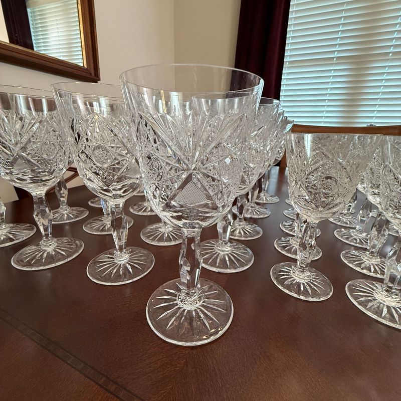 Large crystal stemware set, similar to Imperial style with cut star and fan pattern, tumblers show some haziness, stemmed pieces in very nice condition Large crystal stemware set, similar to Imperial style with cut star and fan pattern, tumblers show some haziness, stemmed pieces in very nice condition