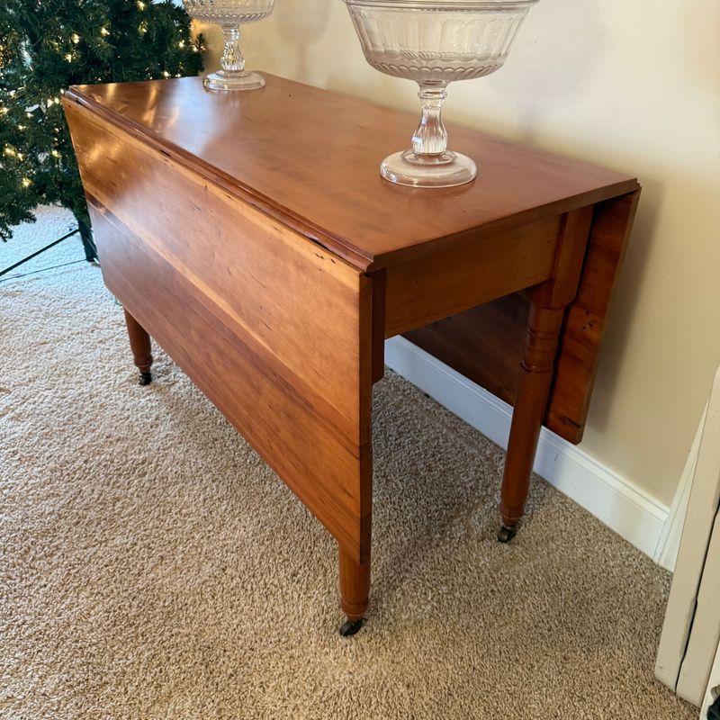 Beautiful drop leaf table on casters, swing-arm support has quarter-round blocking it opening (could be removed)  3'7"L x 19"W