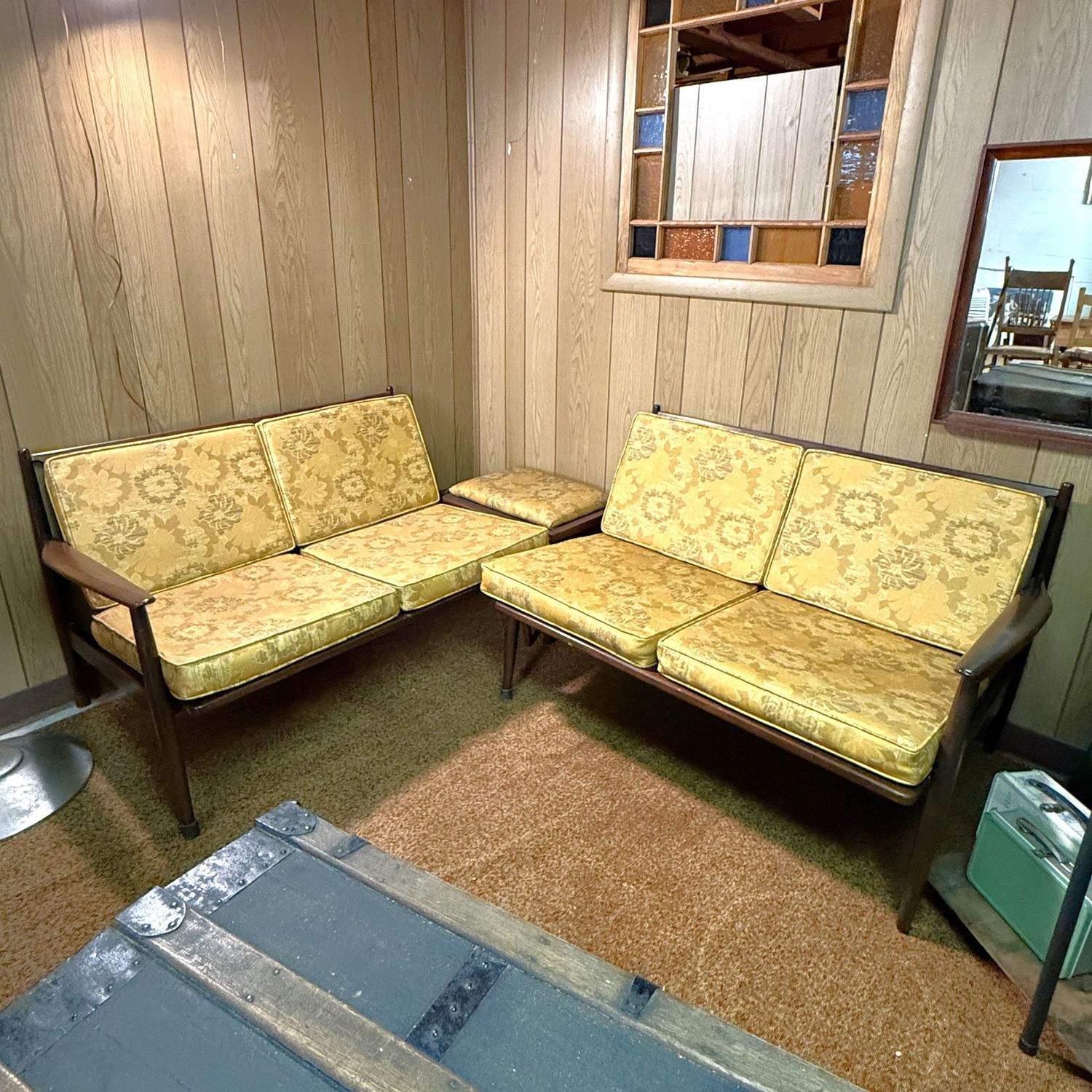 Pair of MCM Danish sectional loveseats 29"H x 30"D x 42"L with accent table/bench in the Kofod Larsen-style, walnut with yellow floral vinyl upholstery (This item is downstairs)