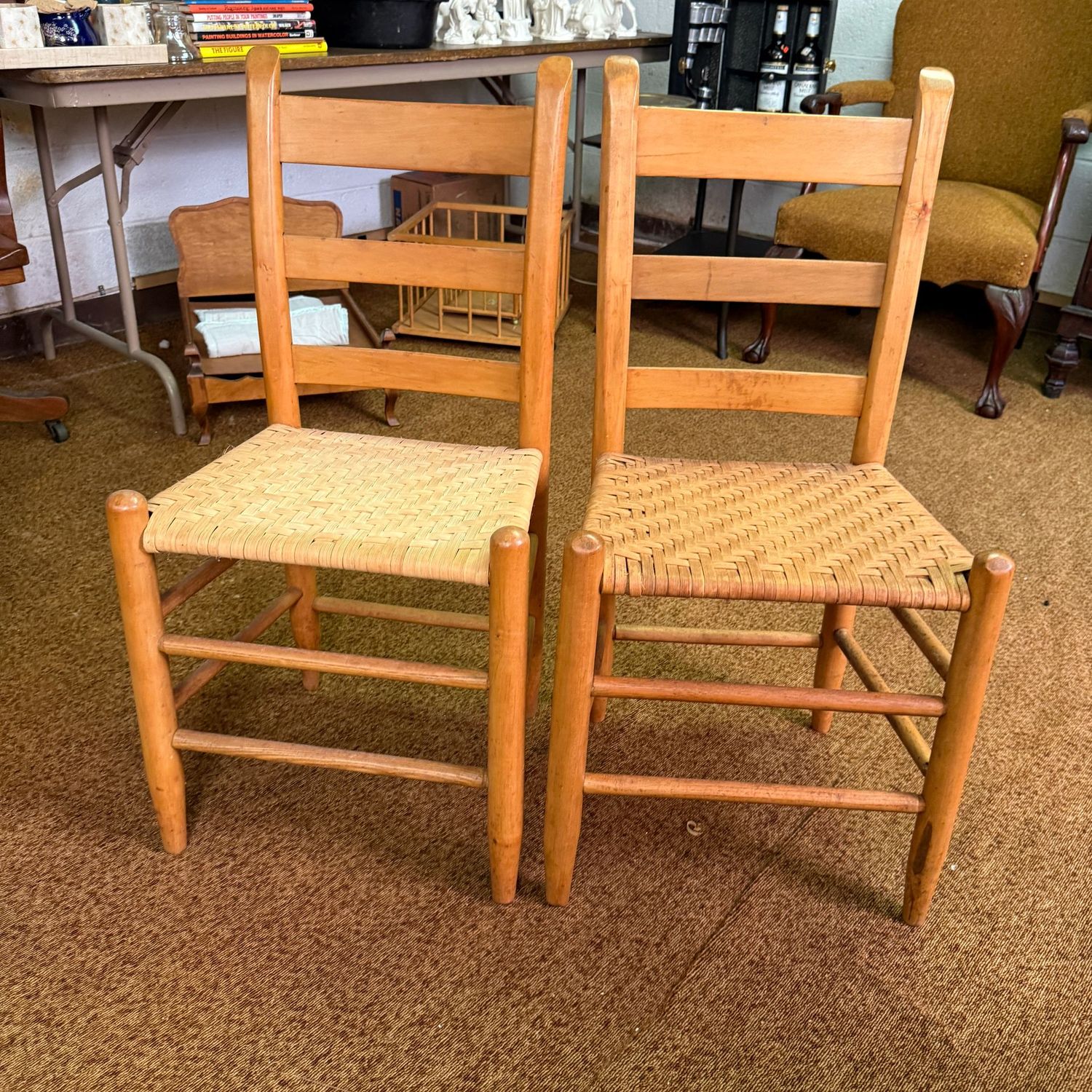 Two slat-back chairs with rush woven seats 29"H x 16"W