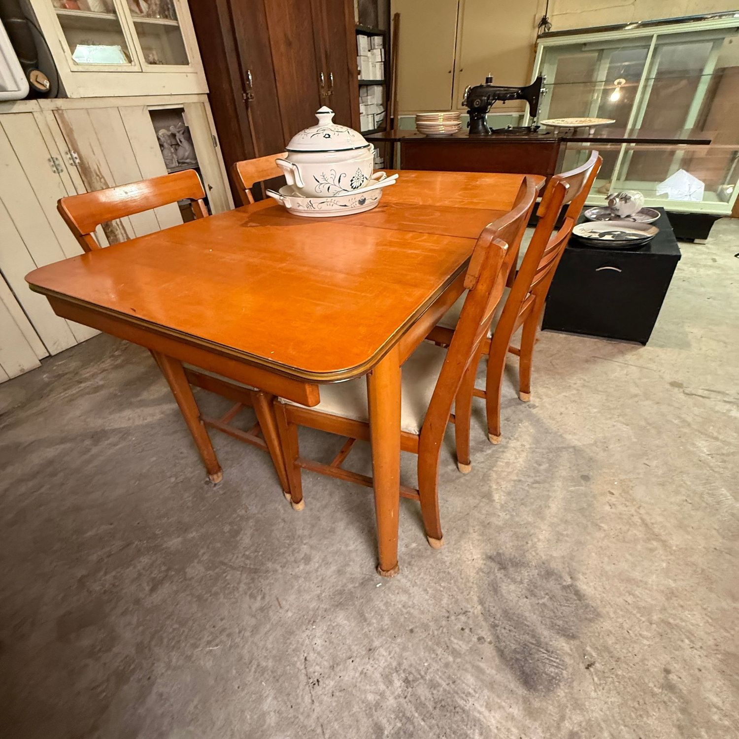 Vintage dining table and chairs autumn flax color, leaf inserted is 4'5"L x 30"W, 4 chairs have thin padded seats with protective plastic covering (this item is in the lower level)