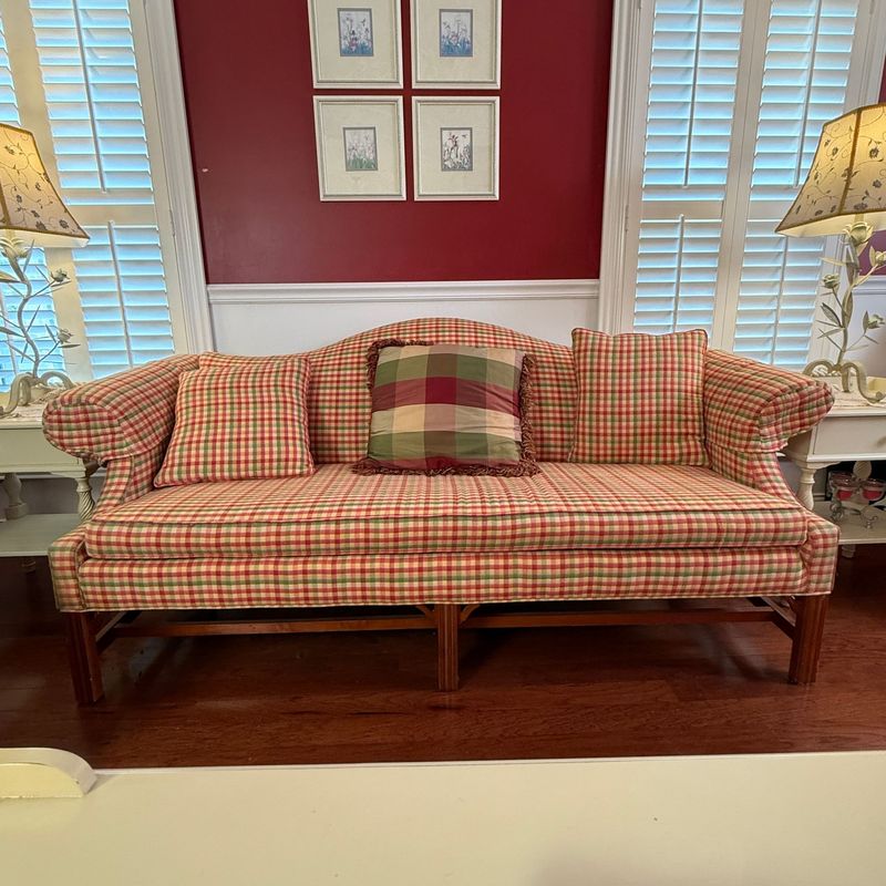 Camel back sofa in red, green, and tan plaid, a little wear, a few thread pulls 6'6"W x 35"D