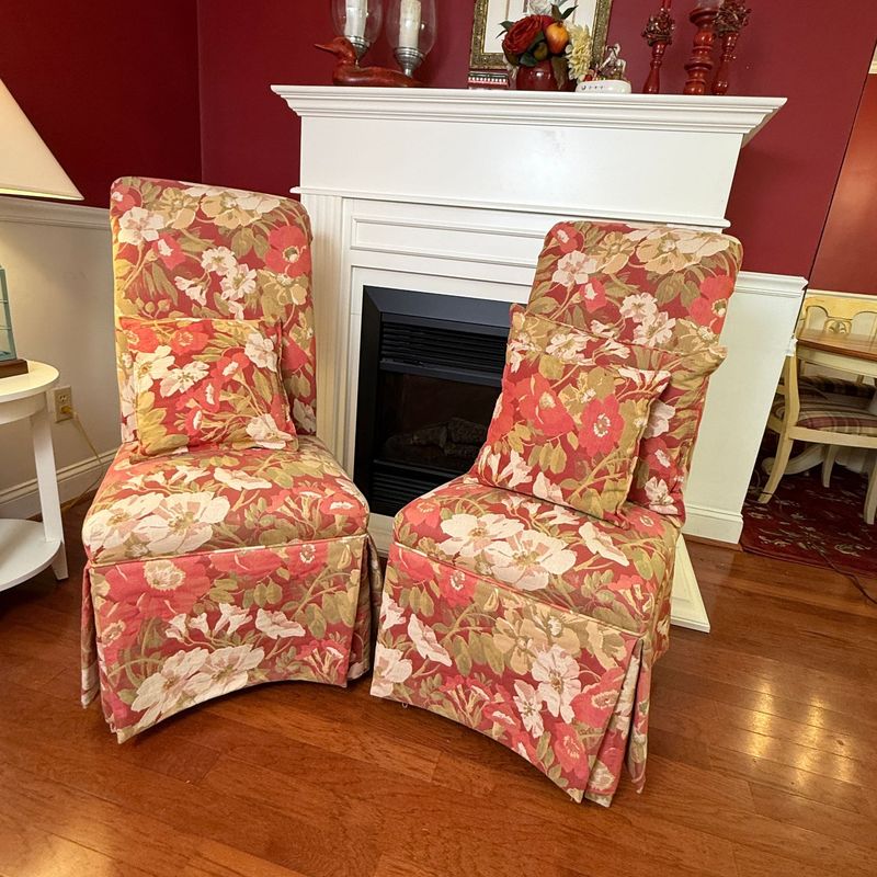 Two floral upholstered side chairs, long skirt and pillows 40"H x 20"W