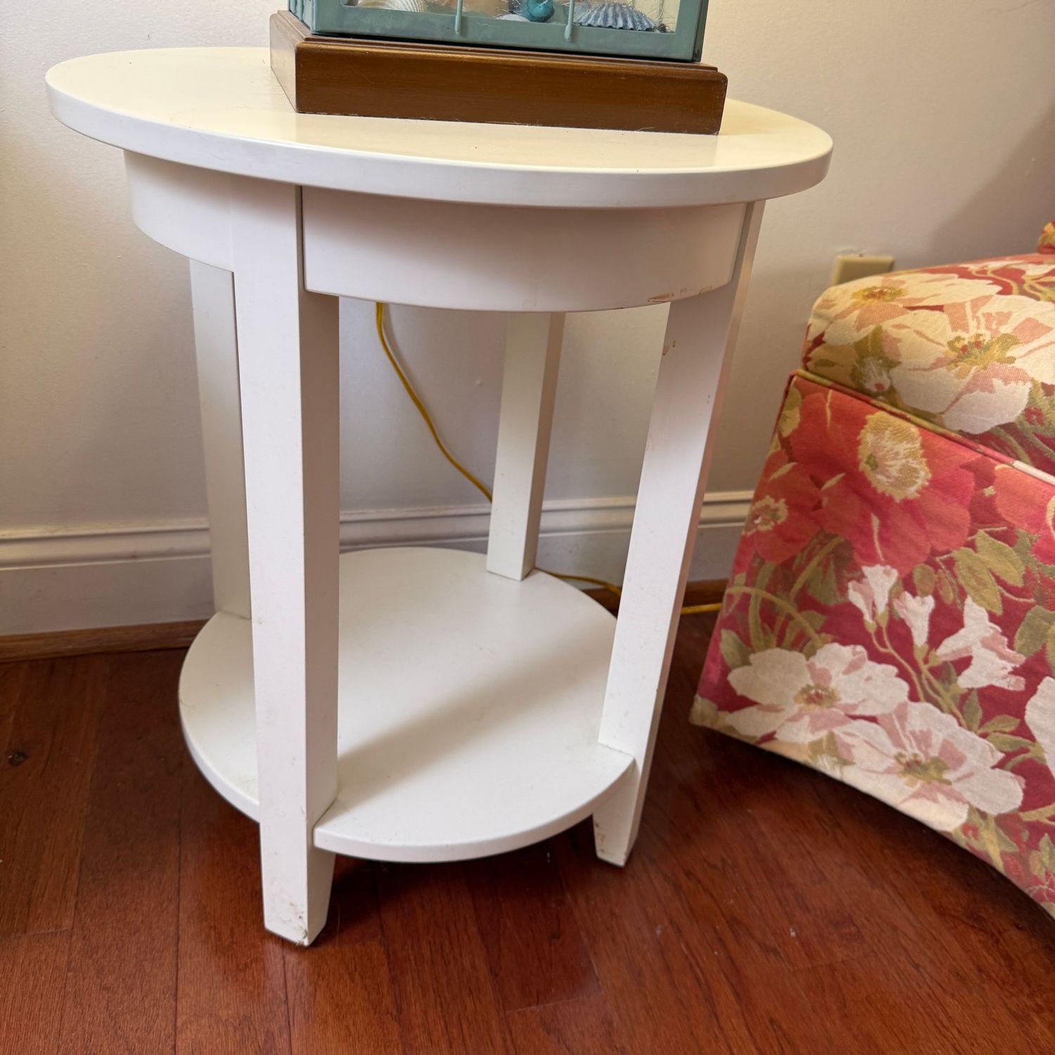 Round white laminate side table with lower shelf 23"H x 18"W