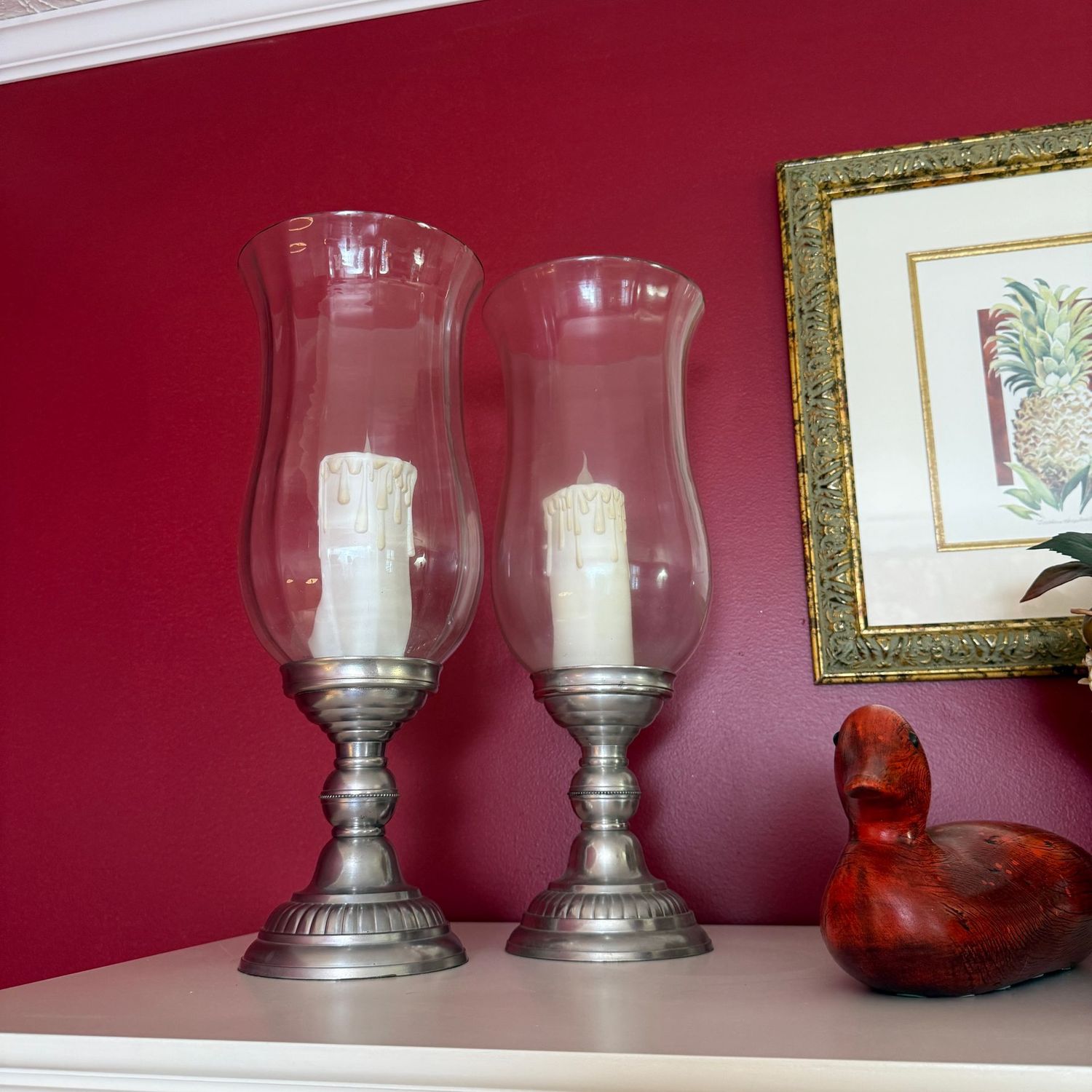 Pair of pewter candle holders with glass chimneys, slender battery-operated pillar candles 19"H