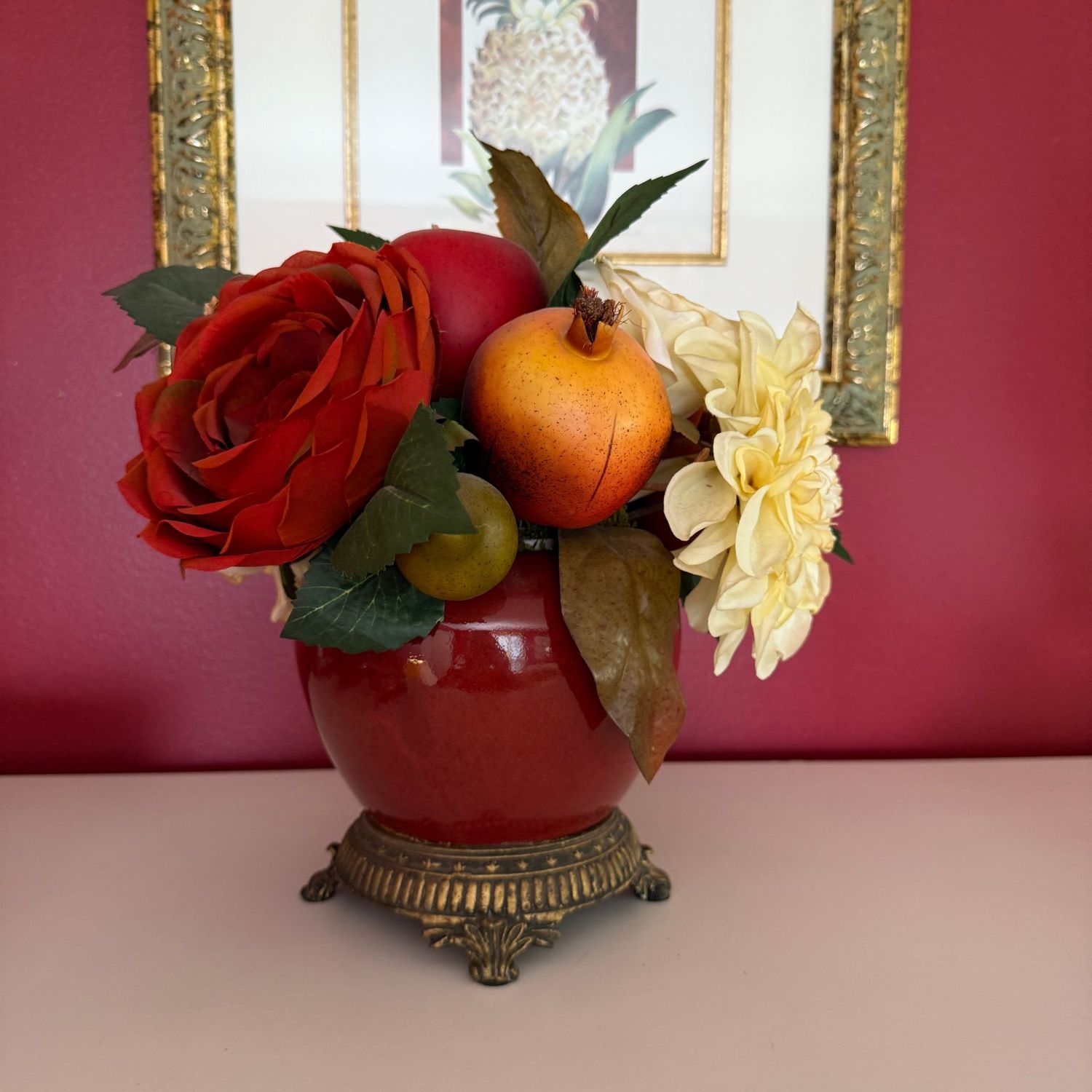 Dark red ceramic planter with cast metal base, fruit and flowers arrangement 10"H