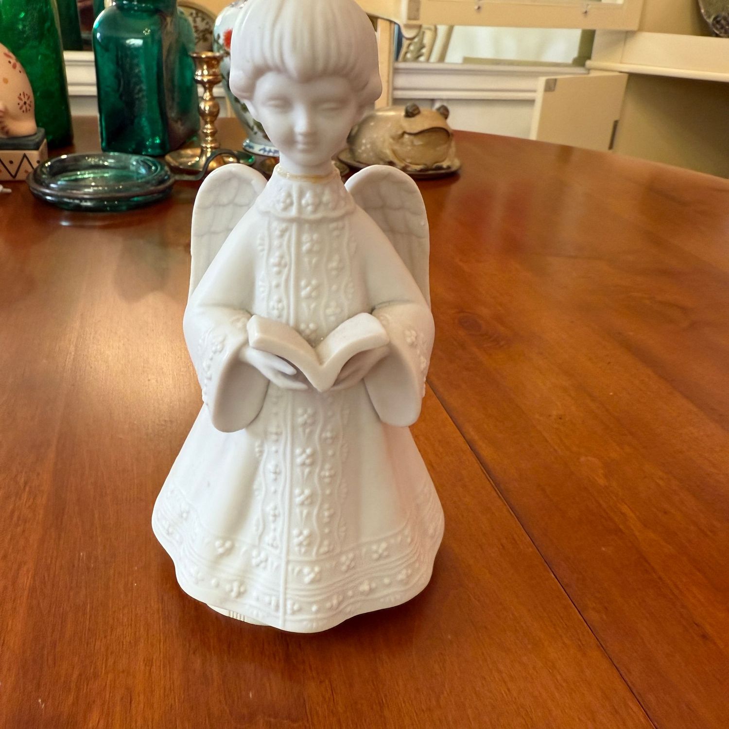 Singing angel bisque porcelain music box figurine (neck has been repaired) 4"