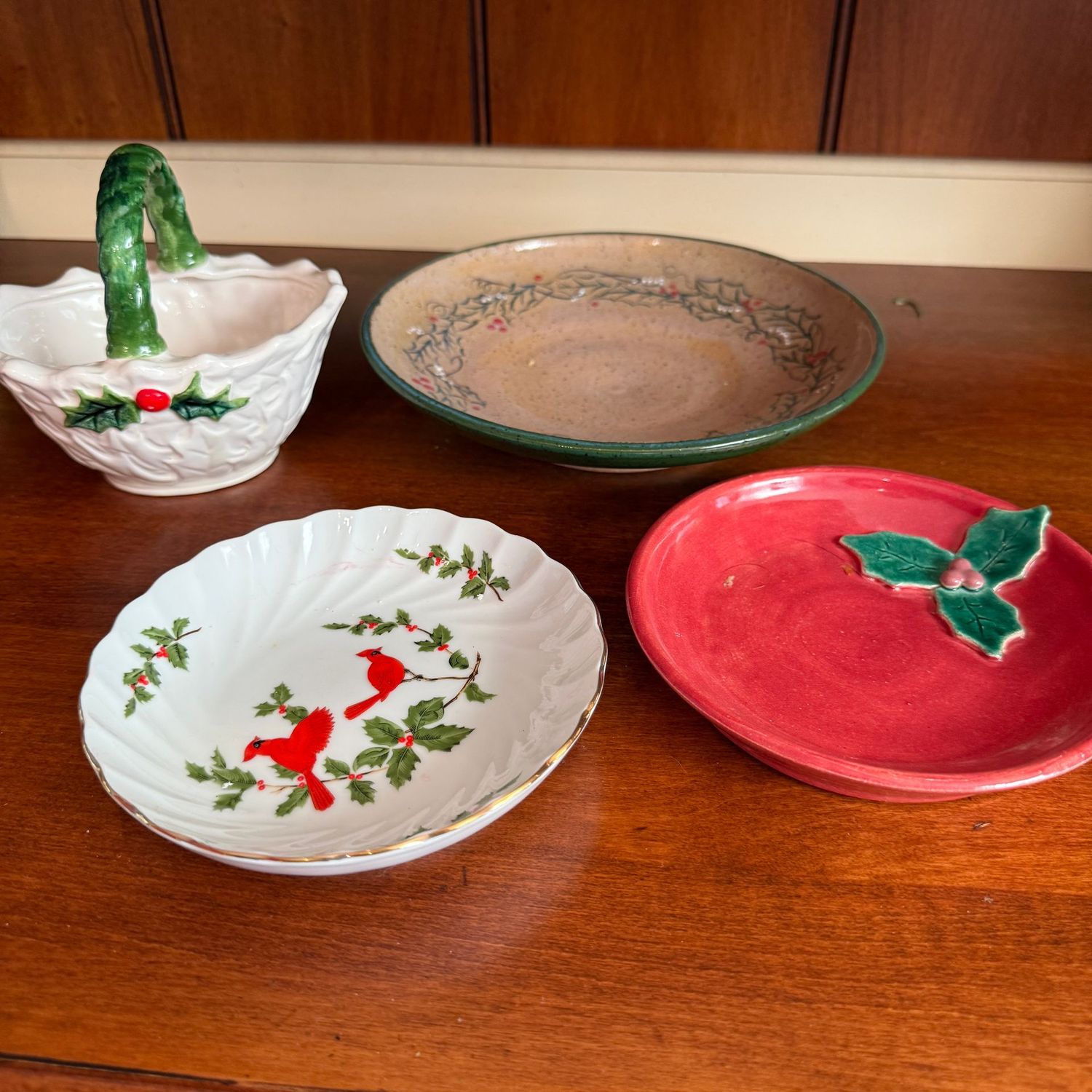 Grouping of Christmas ceramic basket and small dishes, largest is 6"
