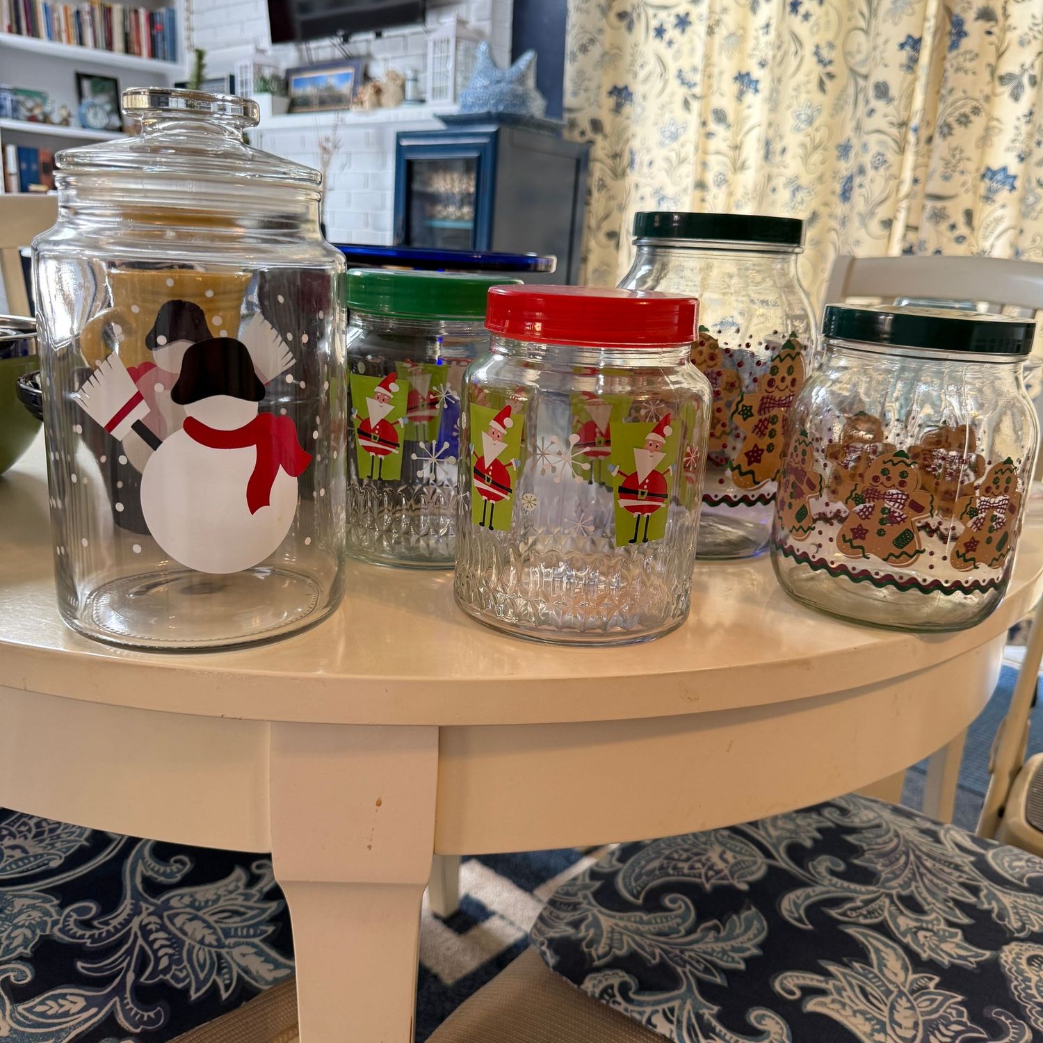 Group of Christmas glass jars and canisters, the largest is 10"