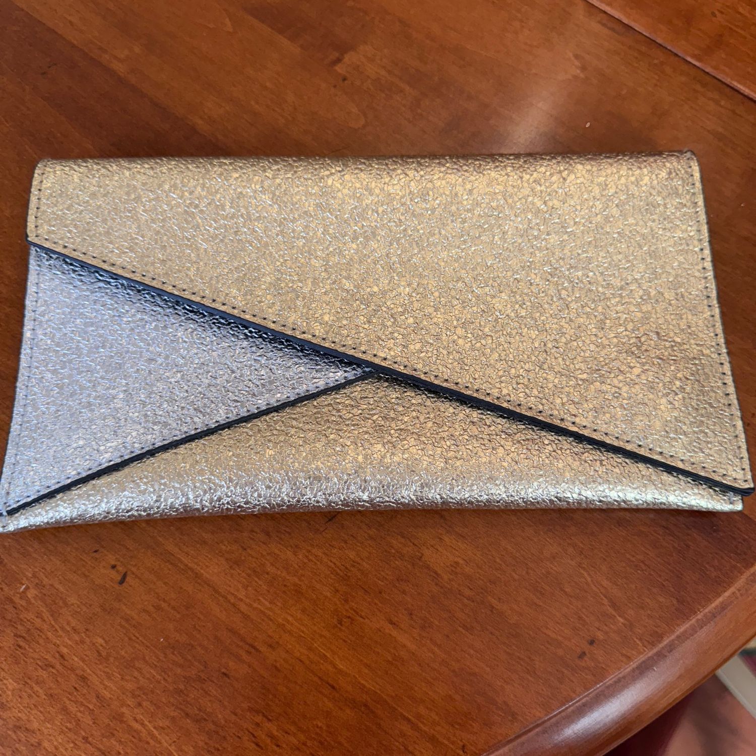 Vintage silver and gold Estee Lauder clutch