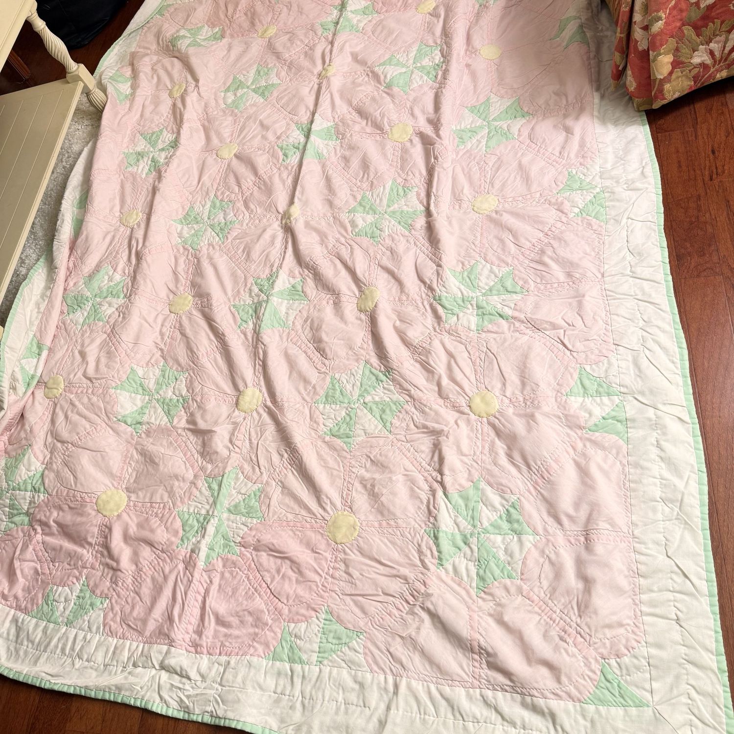 Pale pink, yellow, and green pinwheel quilt 94" x 60"