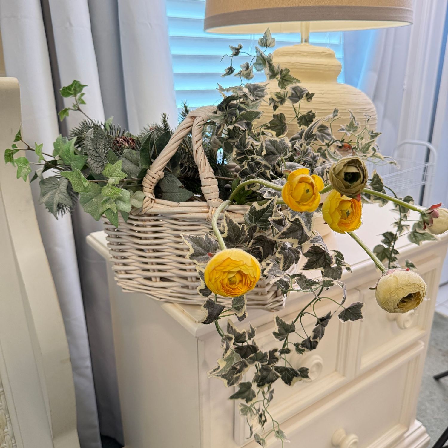 White basket 9"H with floral and vine arrangement